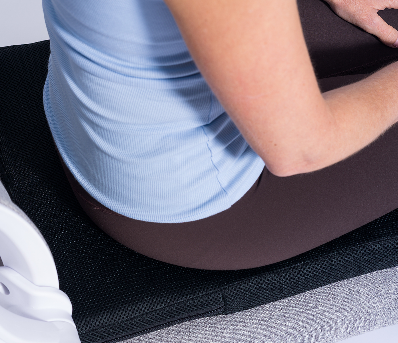 woman sat on the seat topper