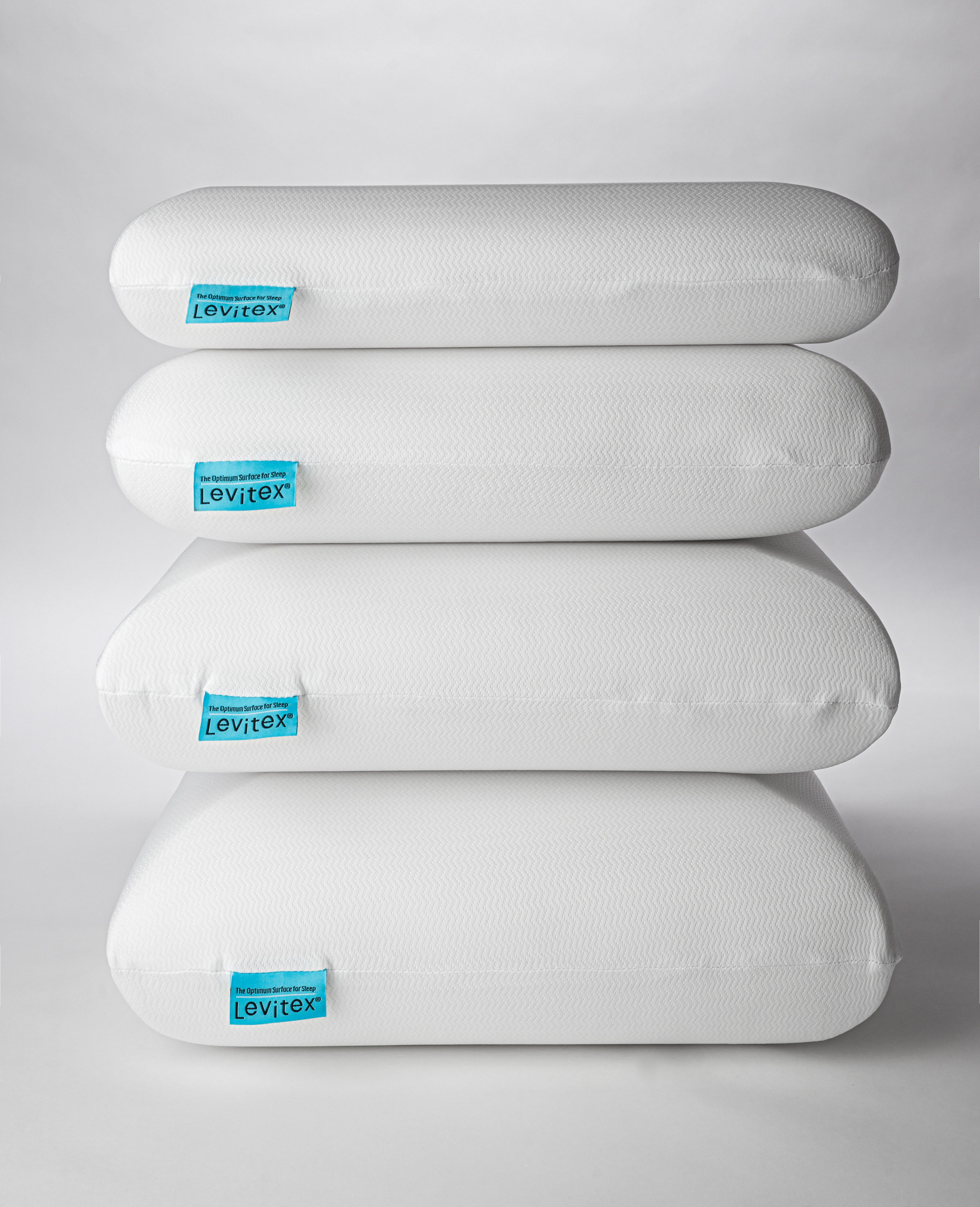 photo of 4 levitex pillows stacked on top of each other