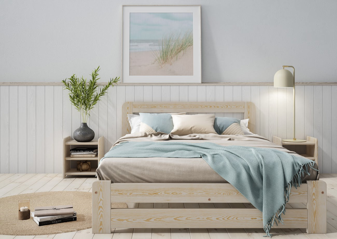 Wooden bed with grey bedding and a blue blanket in a bedroom setting