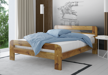 Wooden bed with blue bedding in a modern bedroom setting