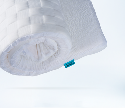 close up of a rolled mattress topper