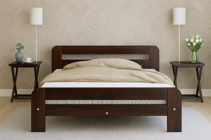 Wooden bed with beige blanket in a room with two side tables and lamps.