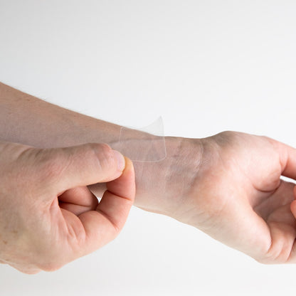 a patch being applied on wrist