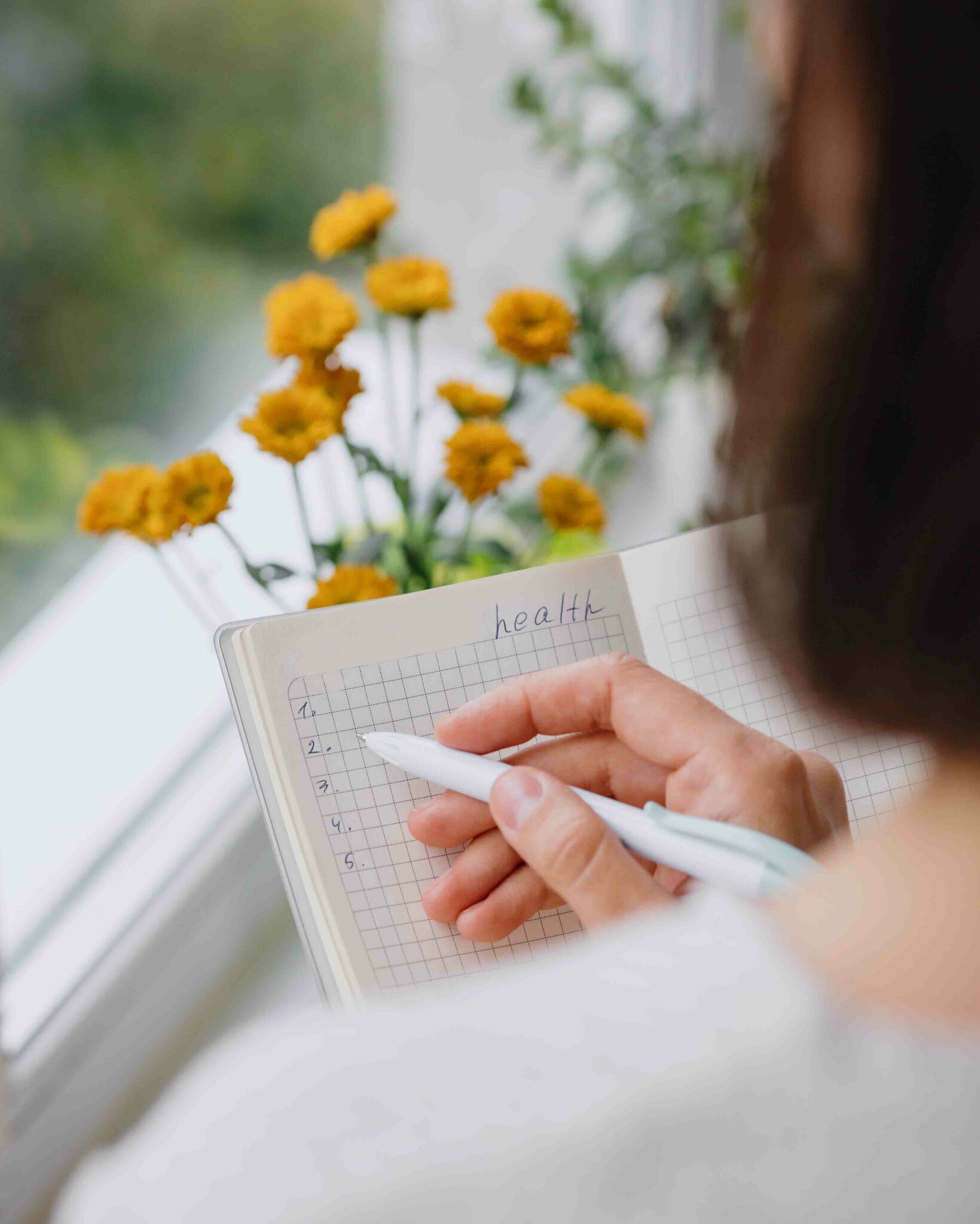 Woman journaling about her health