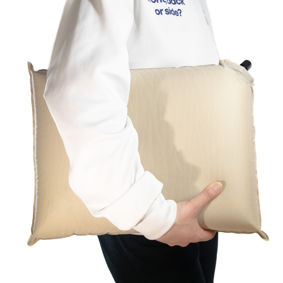 Anywhere pillow held by a 5'2 woman